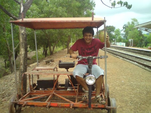 Anupam enjoying a ride on the rail-maintenance vehicle